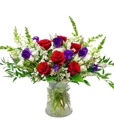 Pink, Purple, Red Roses & Lisianthus is Clear Glass Cylinder
