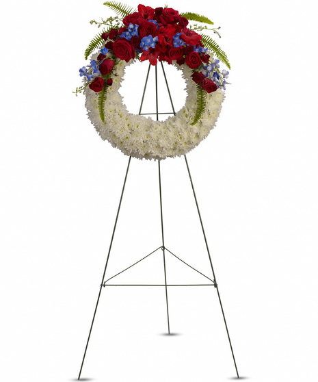 White Wreath with Red Roses & Blue Delphinium