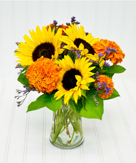 Marigolds & Sunflowers in a Clear Glass Cylinder